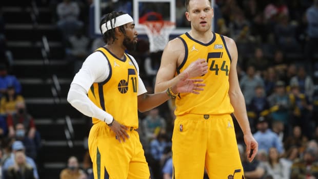 Utah Jazz guard Mike Conley (11) and Utah Jazz forward Bojan Bogdanovic (44) talk during a timeout during the second half against the Memphis Grizzles at FedExForum.